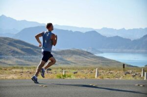 man running mountains scaled 1